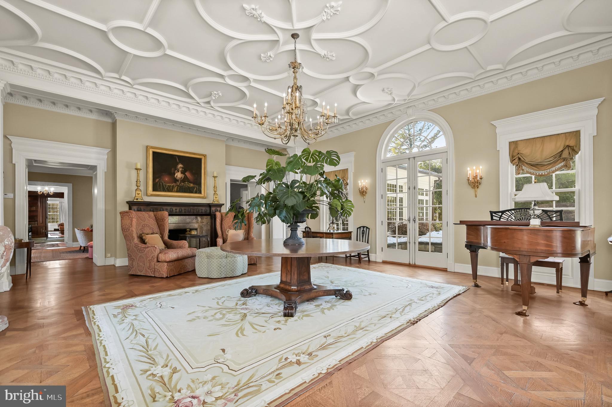 5320 27th Street Northwest Washington, DC 20015 - Photo 7 of 42 a living room with furniture a chandelier and a large mirror