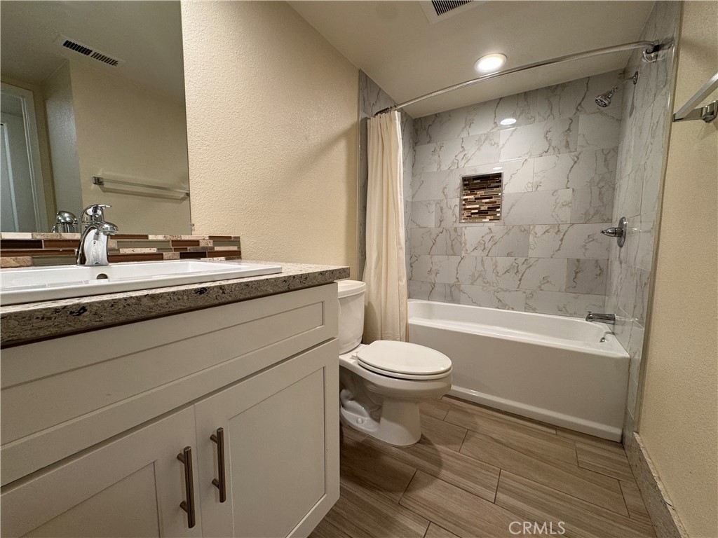 34102 Selva Road, Unit 364 Dana Point, CA 92629 - Photo 11 of 17 a bathroom with a sink a toilet and shower