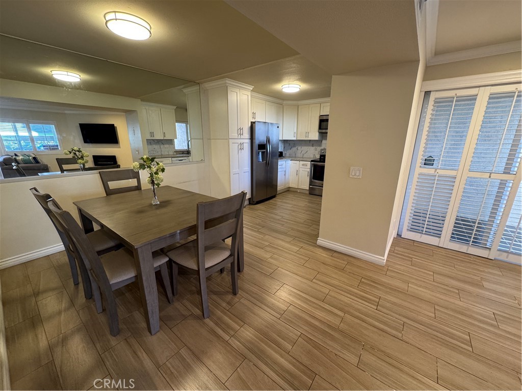 34102 Selva Road, Unit 364 Dana Point, CA 92629 - Photo 7 of 17 a view of a dining room with furniture and wooden floor