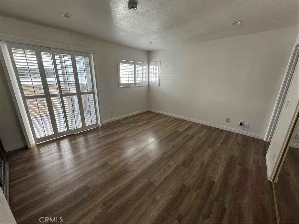 34102 Selva Road, Unit 364 Dana Point, CA 92629 - Photo 9 of 17 wooden floor in an empty room with a window