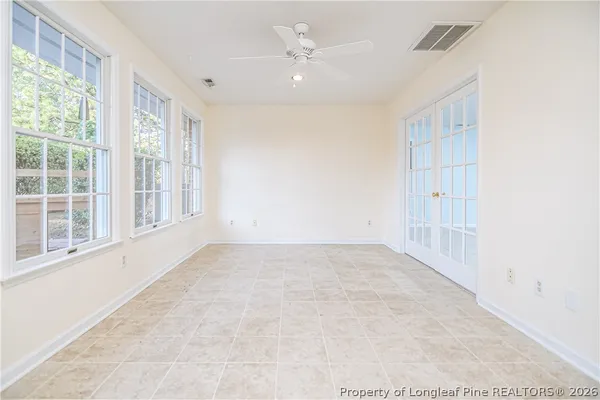 a living room with furniture and white walls