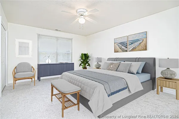 an empty room with closet and fan