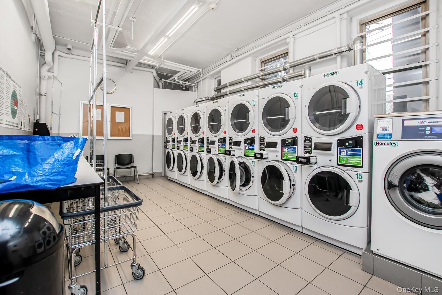 219 Bronx River Road, Unit 5A Yonkers, NY 10704 - Photo 12 of 14 a utility room with dryer and washer