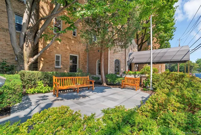 front view of a house with a garden