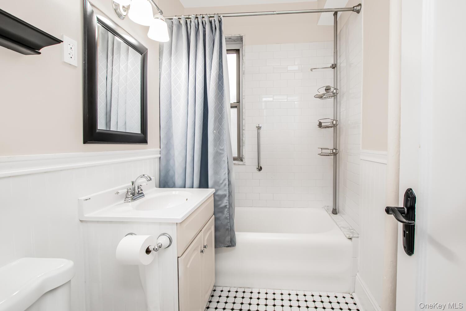 219 Bronx River Road, Unit 5A Yonkers, NY 10704 - Photo 9 of 14 a bathroom with a shower a sink and a mirror