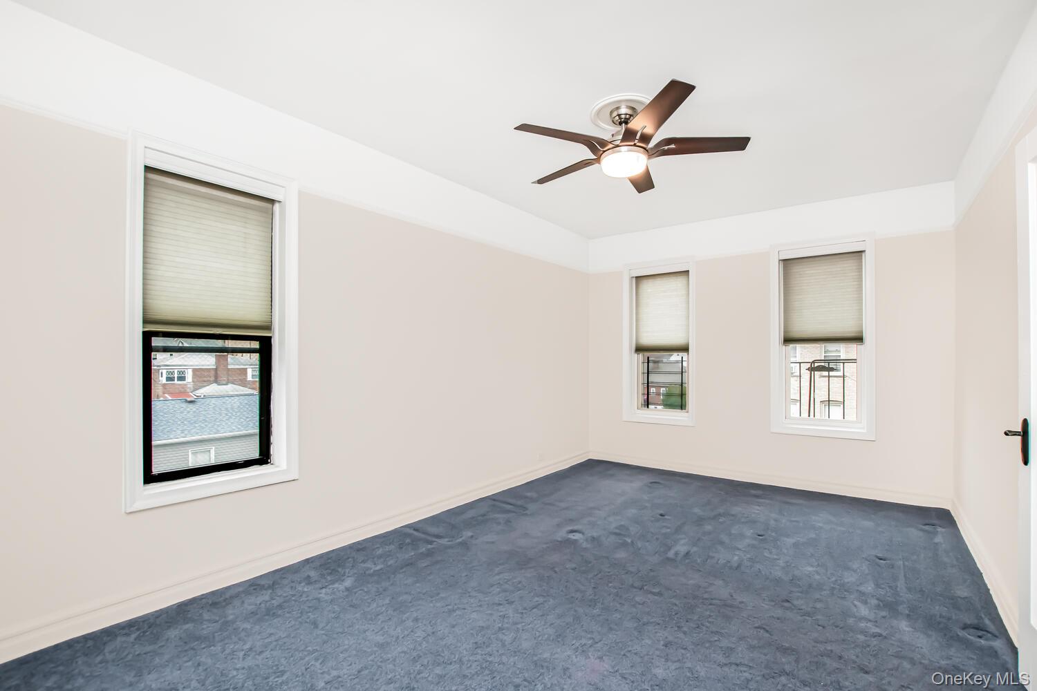 219 Bronx River Road, Unit 5A Yonkers, NY 10704 - Photo 10 of 14 a view of empty room with windows
