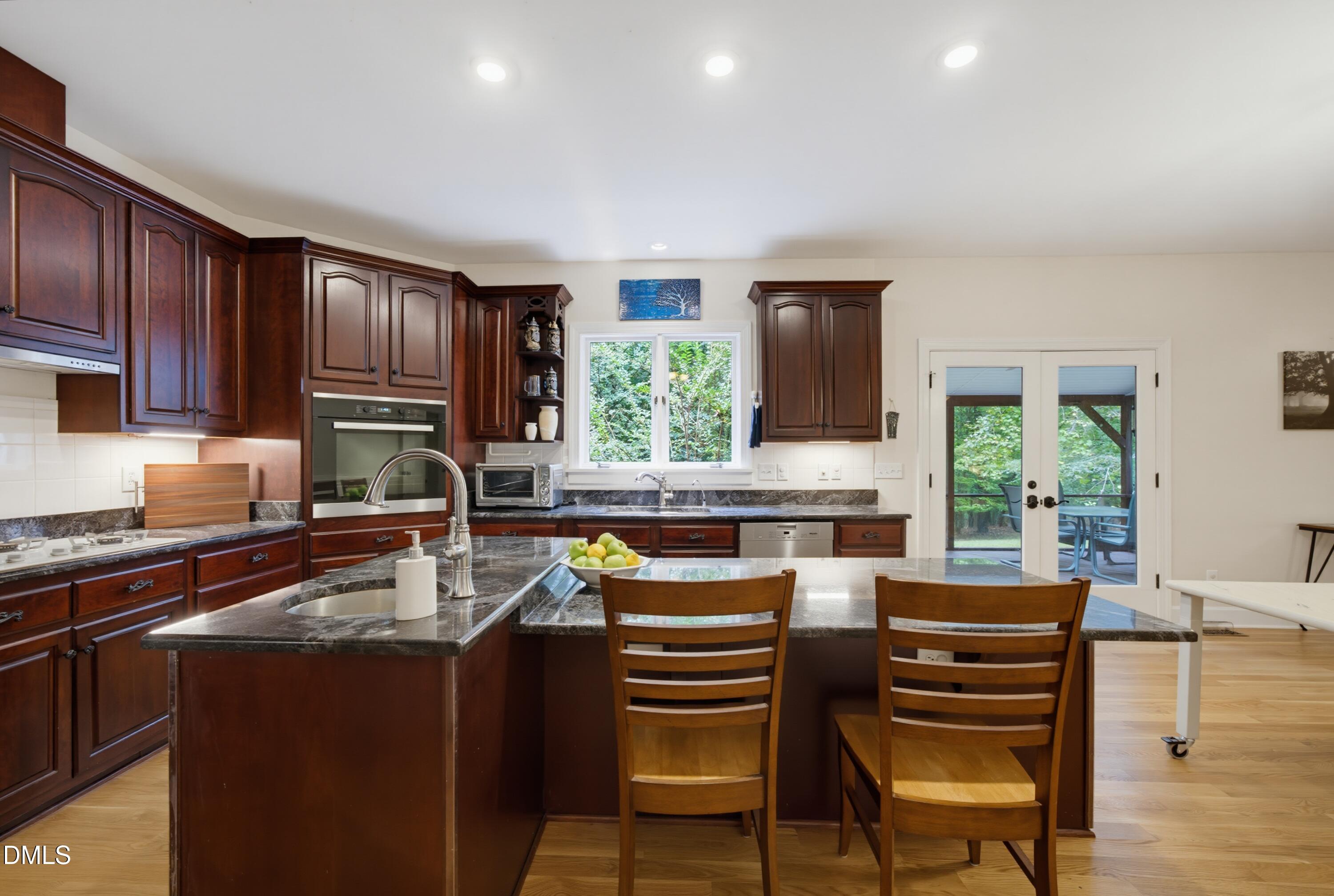 1105 Erins Way Lane Raleigh, NC 27614 - Photo 15 of 82 Table height lower section of island