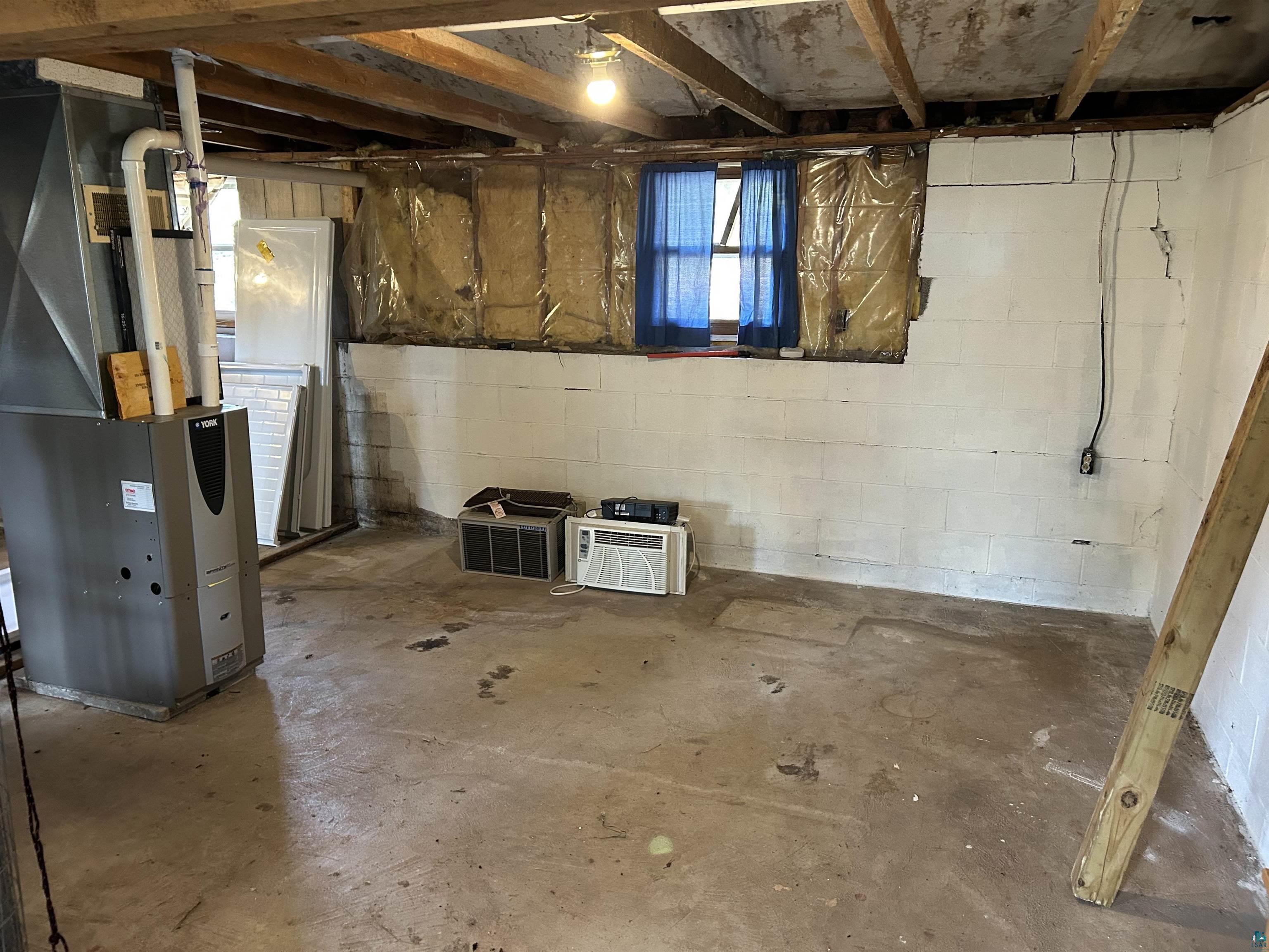 4184 Bergstrom Road Two Harbors, MN 55616 - Photo 16 of 20 Basement with heating unit