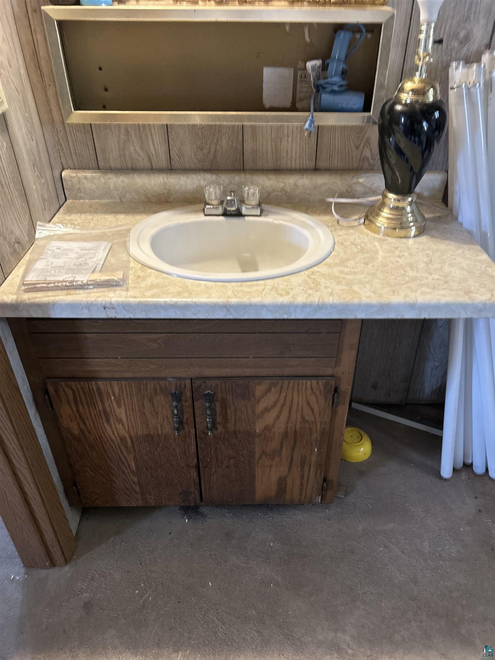 4184 Bergstrom Road Two Harbors, MN 55616 - Photo 18 of 20 Bathroom featuring vanity and unfinished concrete flooring