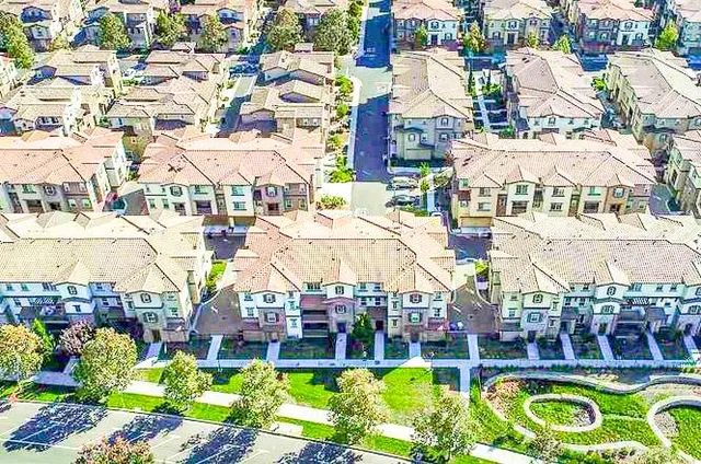 a aerial view of an buildings and swimming pool