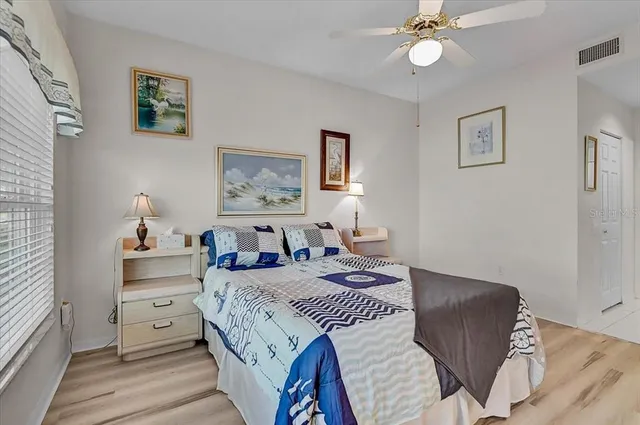 a spacious bathroom with a shower sink and mirror