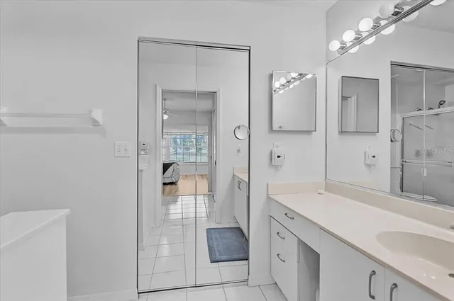 a bathroom with a shower a toilet and sink