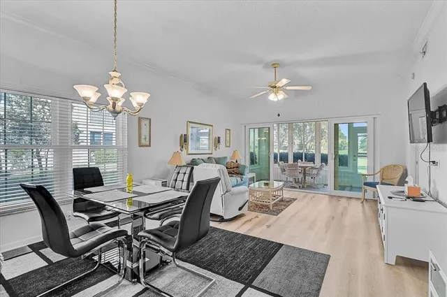a kitchen with stainless steel appliances granite countertop a sink and a refrigerator