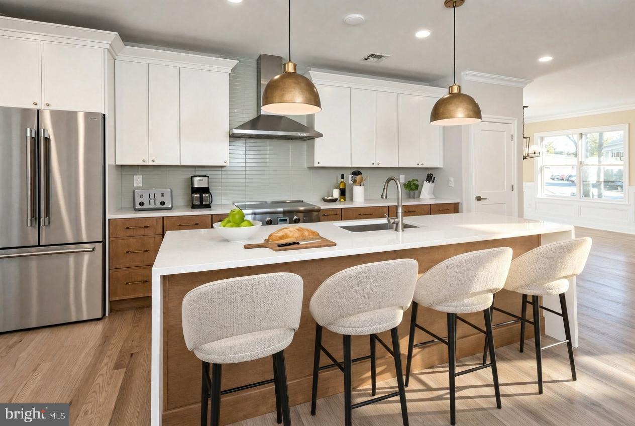 576 Ewing Street Princeton, NJ 08540 - Photo 13 of 61 a kitchen with stainless steel appliances granite countertop a sink a stove a refrigerator cabinets and chairs