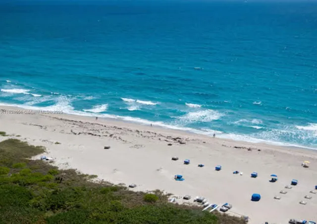 a view of beach and an ocean