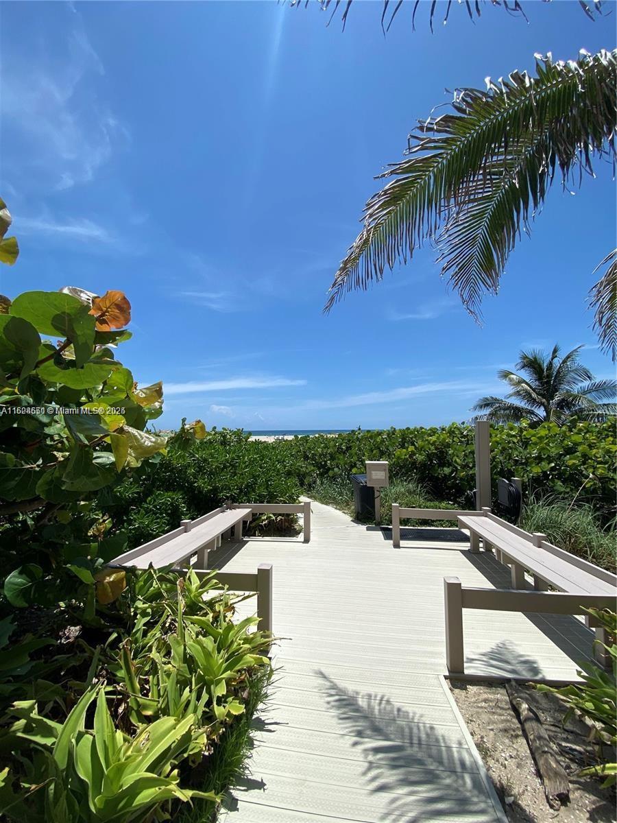 2800 North Ocean Drive, Unit B15C Riviera Beach, FL 33404 - Photo 22 of 32 a view of a terrace with a garden
