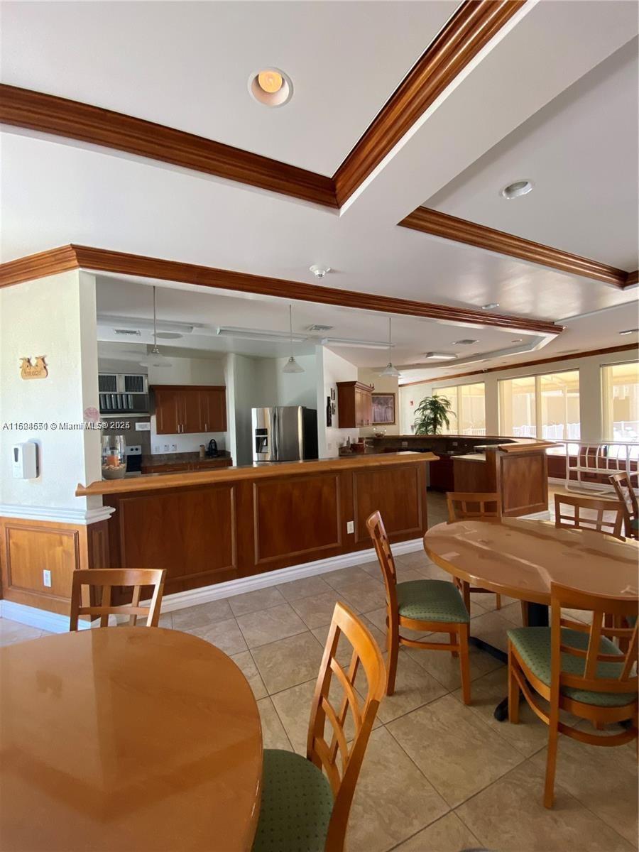 2800 North Ocean Drive, Unit B15C Riviera Beach, FL 33404 - Photo 23 of 32 a view of a dining room with furniture