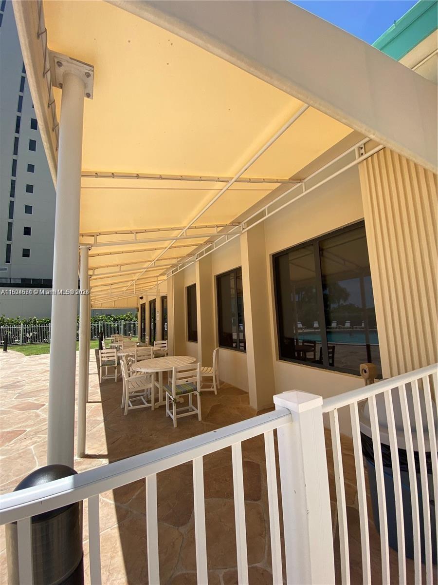 2800 North Ocean Drive, Unit B15C Riviera Beach, FL 33404 - Photo 27 of 32 a view of a balcony with wooden floor and fence