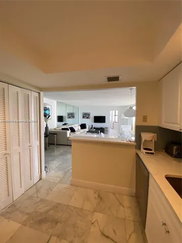 a view of a kitchen with appliances and cabinets