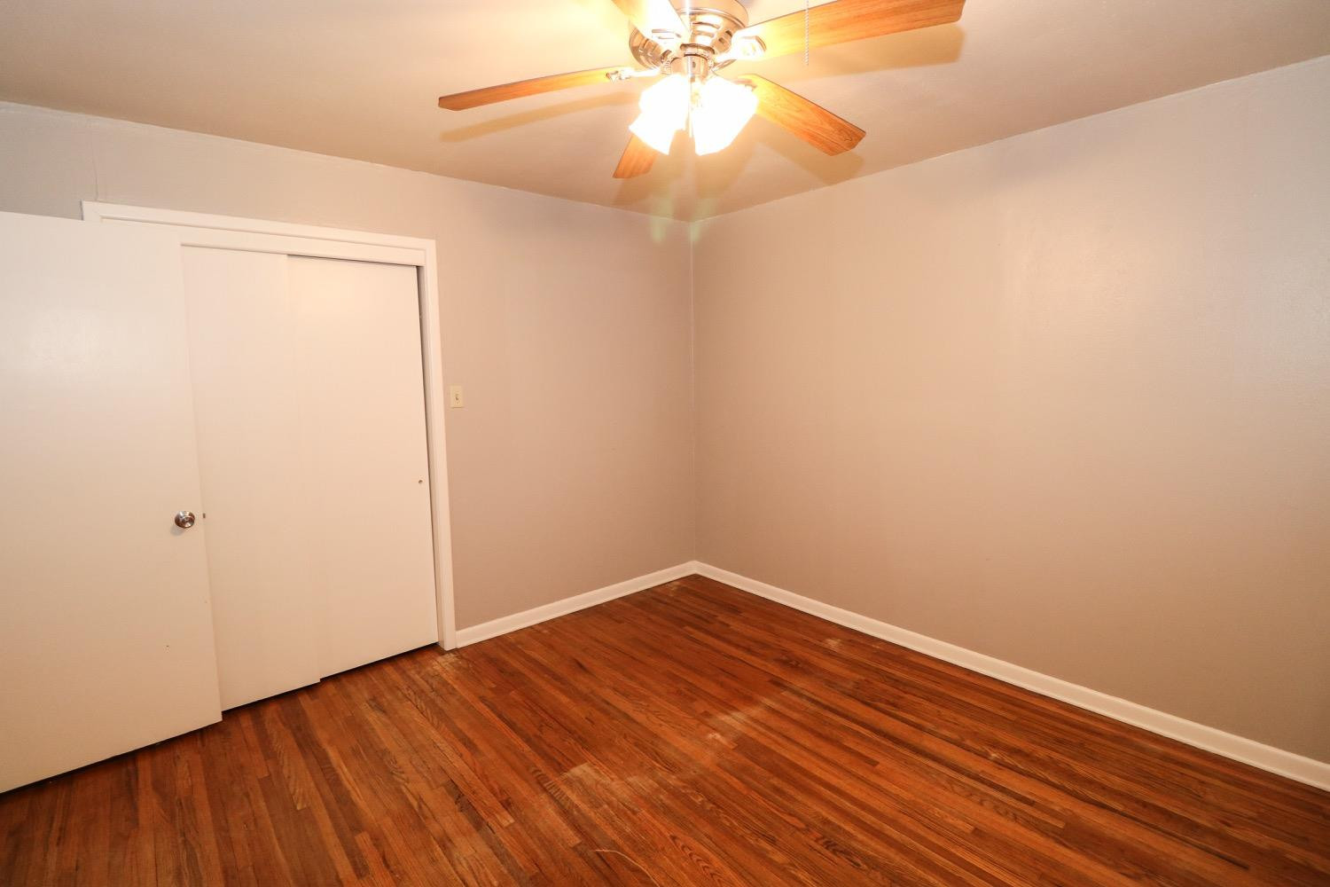 450 County Road 29 Muleshoe, TX 79347 - Photo 14 of 27 a view of an empty room with wooden floor