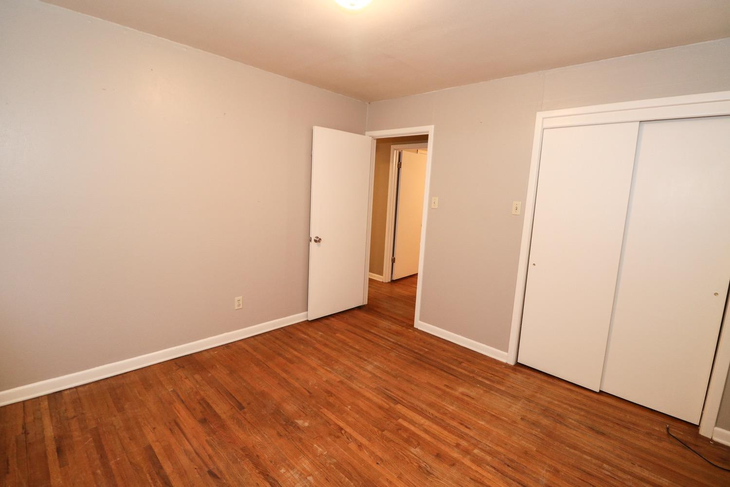 450 County Road 29 Muleshoe, TX 79347 - Photo 16 of 27 a view of an empty room with wooden floor