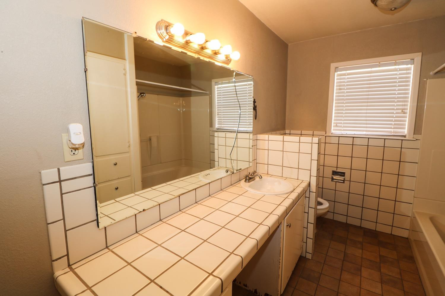 450 County Road 29 Muleshoe, TX 79347 - Photo 17 of 27 a bathroom with a sink and a shower