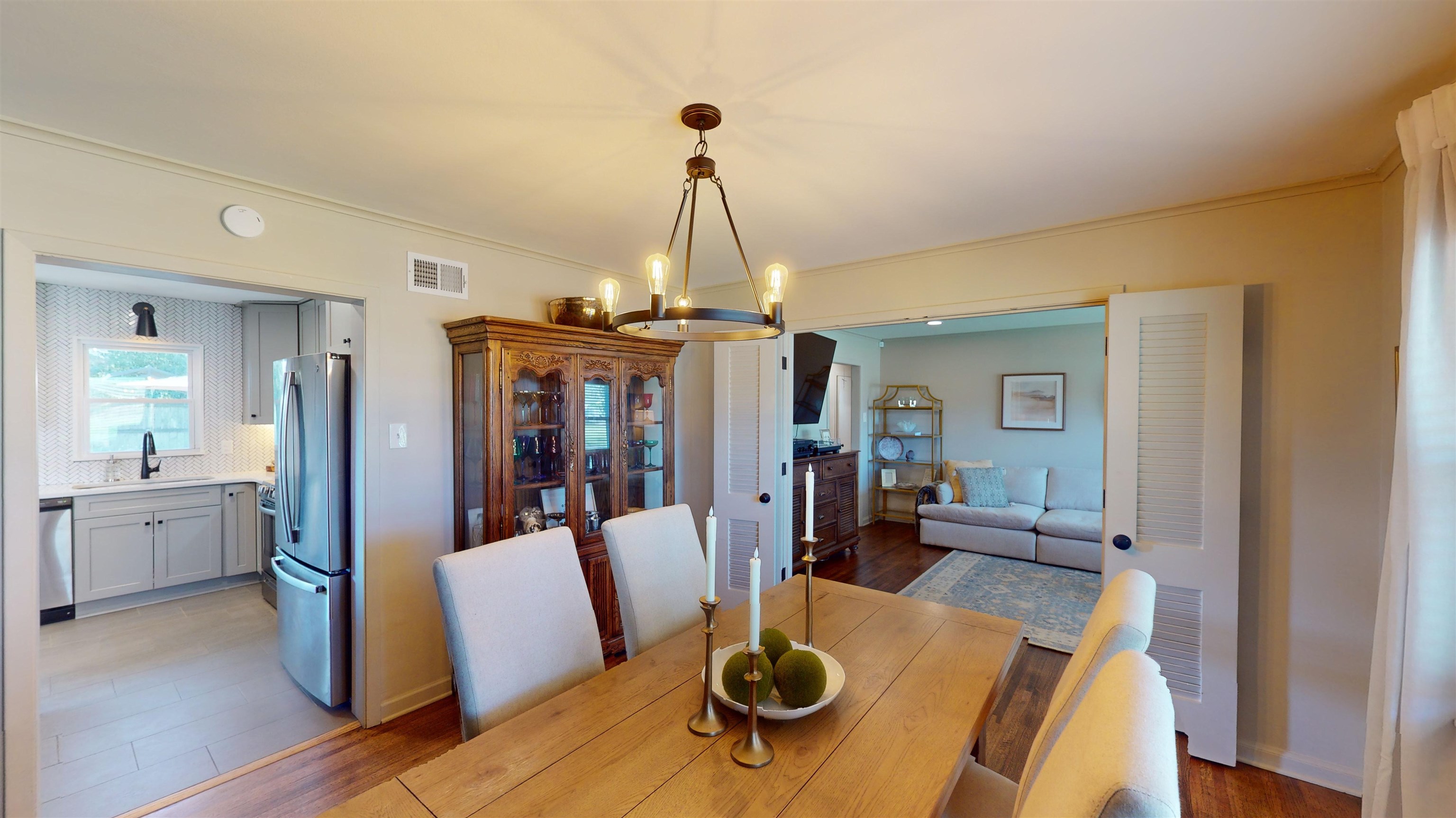 4779 Dee Road Memphis, TN 38117 - Photo 11 of 35 a dining room with furniture a chandelier and wooden floor