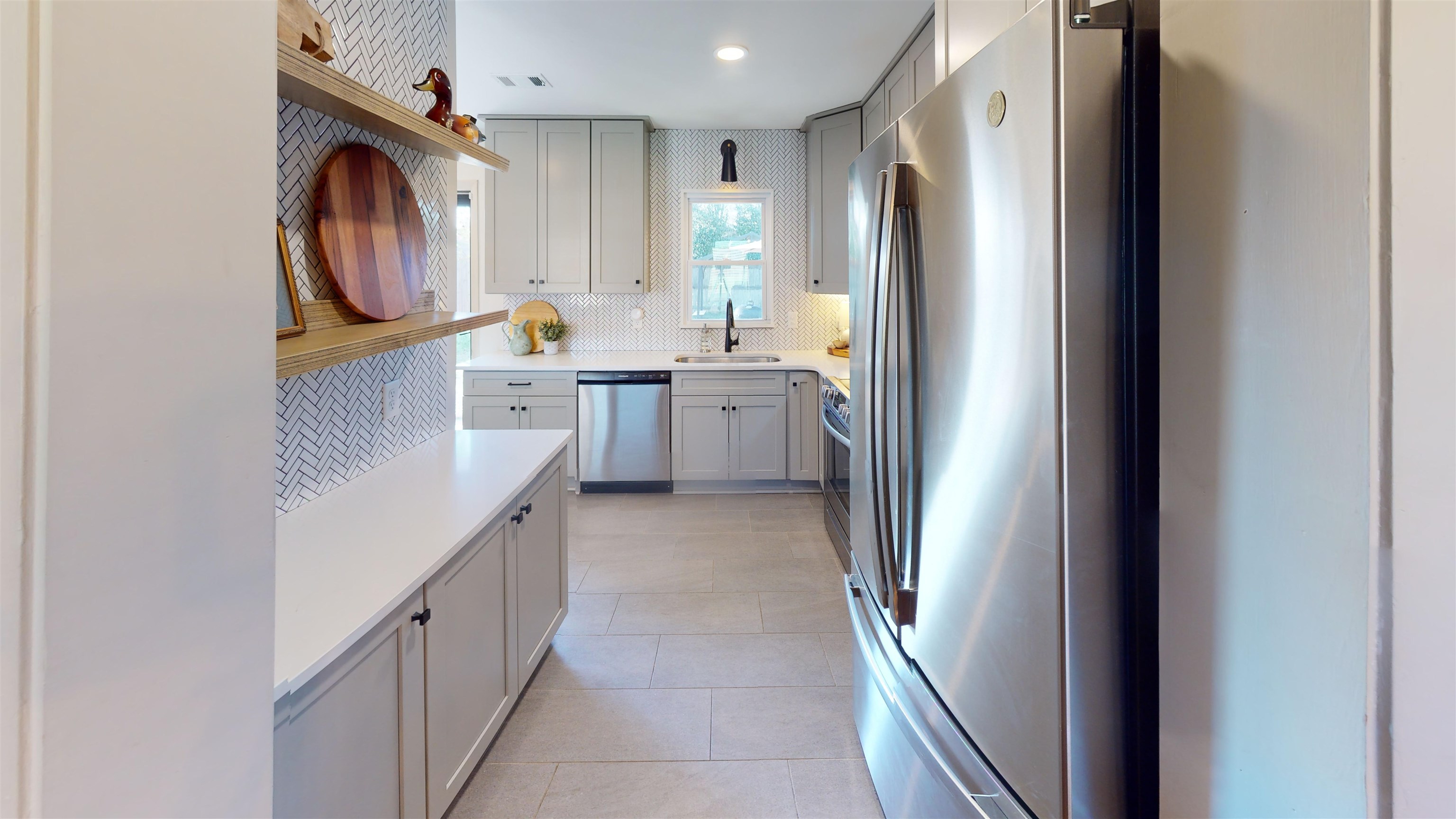 4779 Dee Road Memphis, TN 38117 - Photo 13 of 35 a bathroom with a sink a washer and dryer