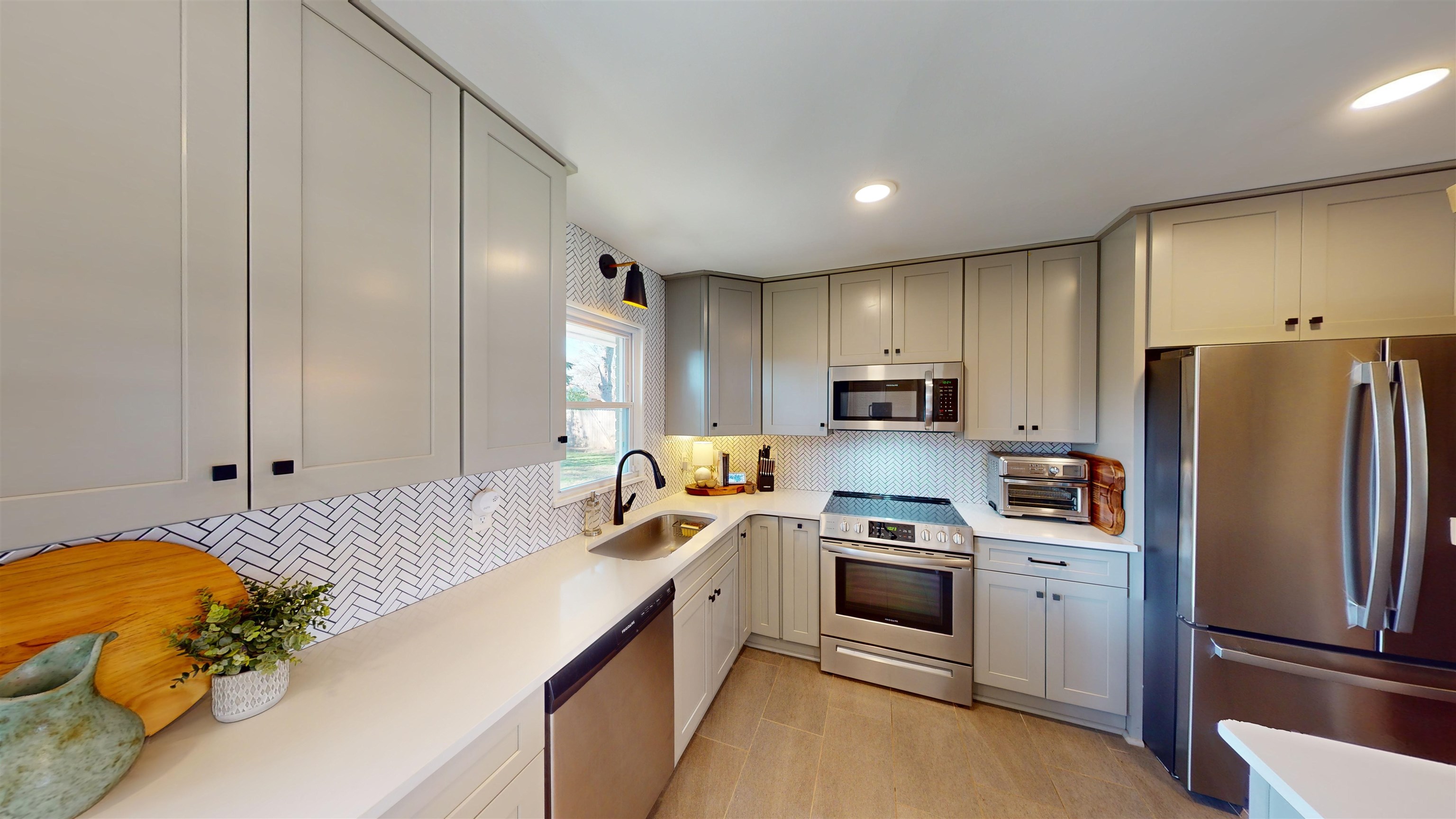 4779 Dee Road Memphis, TN 38117 - Photo 17 of 35 a kitchen with a refrigerator and a stove top oven