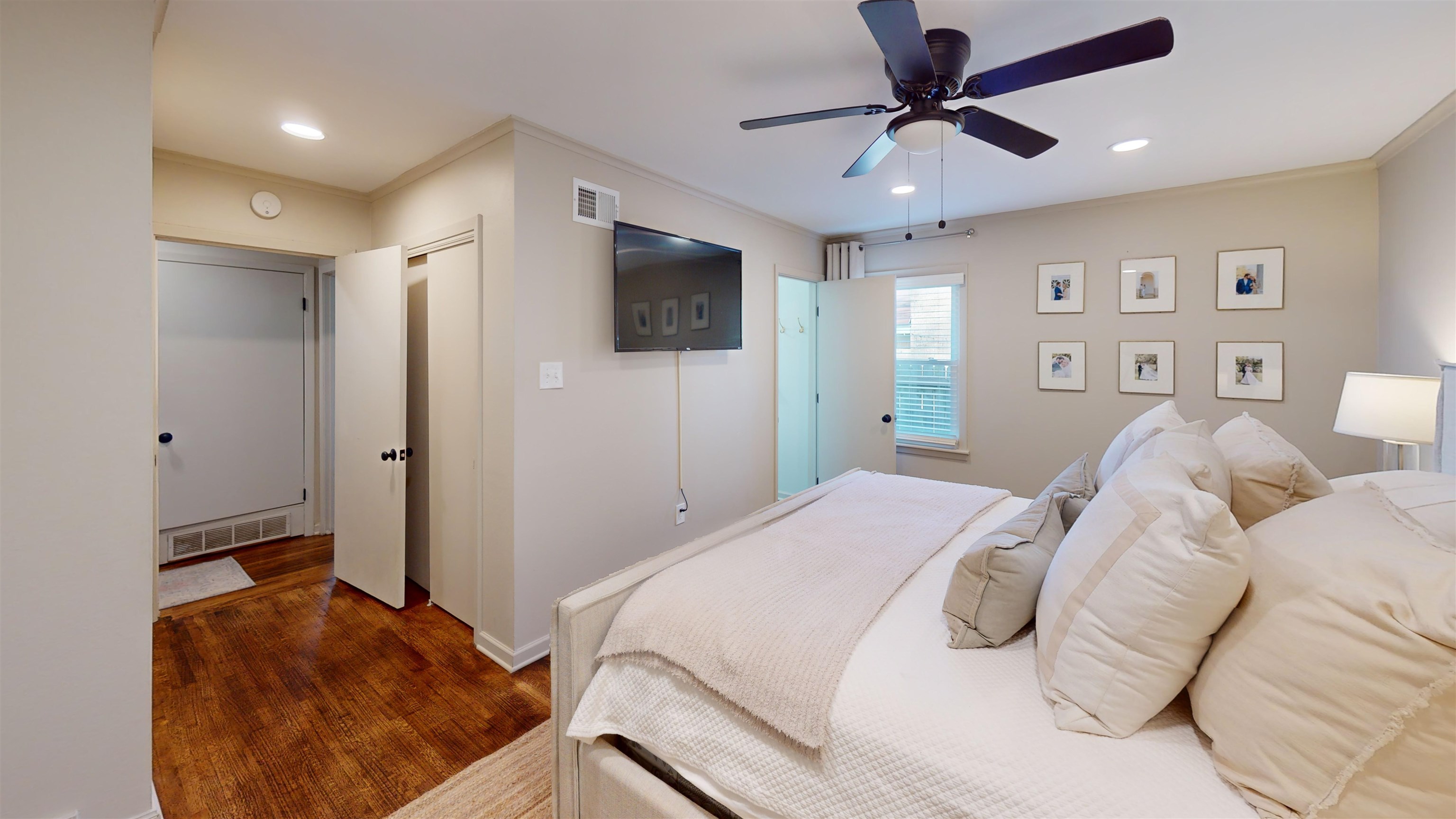 4779 Dee Road Memphis, TN 38117 - Photo 21 of 35 a bedroom with a large bed and a ceiling fan