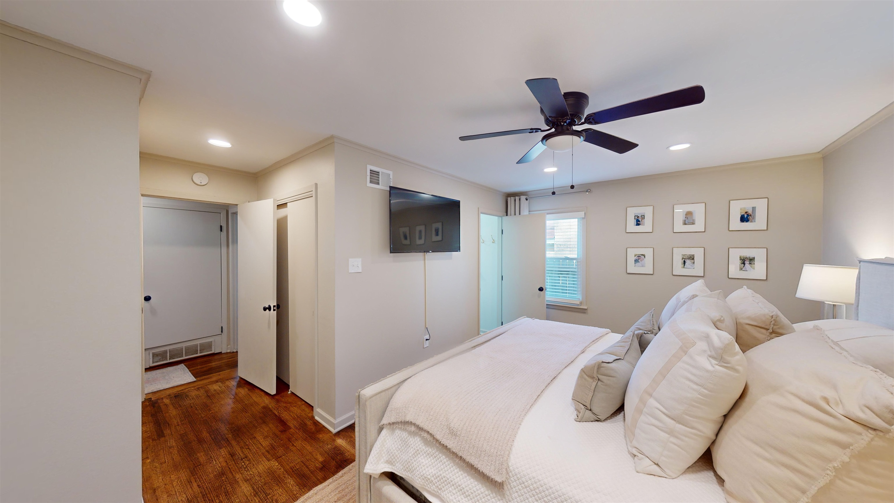 4779 Dee Road Memphis, TN 38117 - Photo 22 of 35 a bedroom with a bed window and a flat screen tv