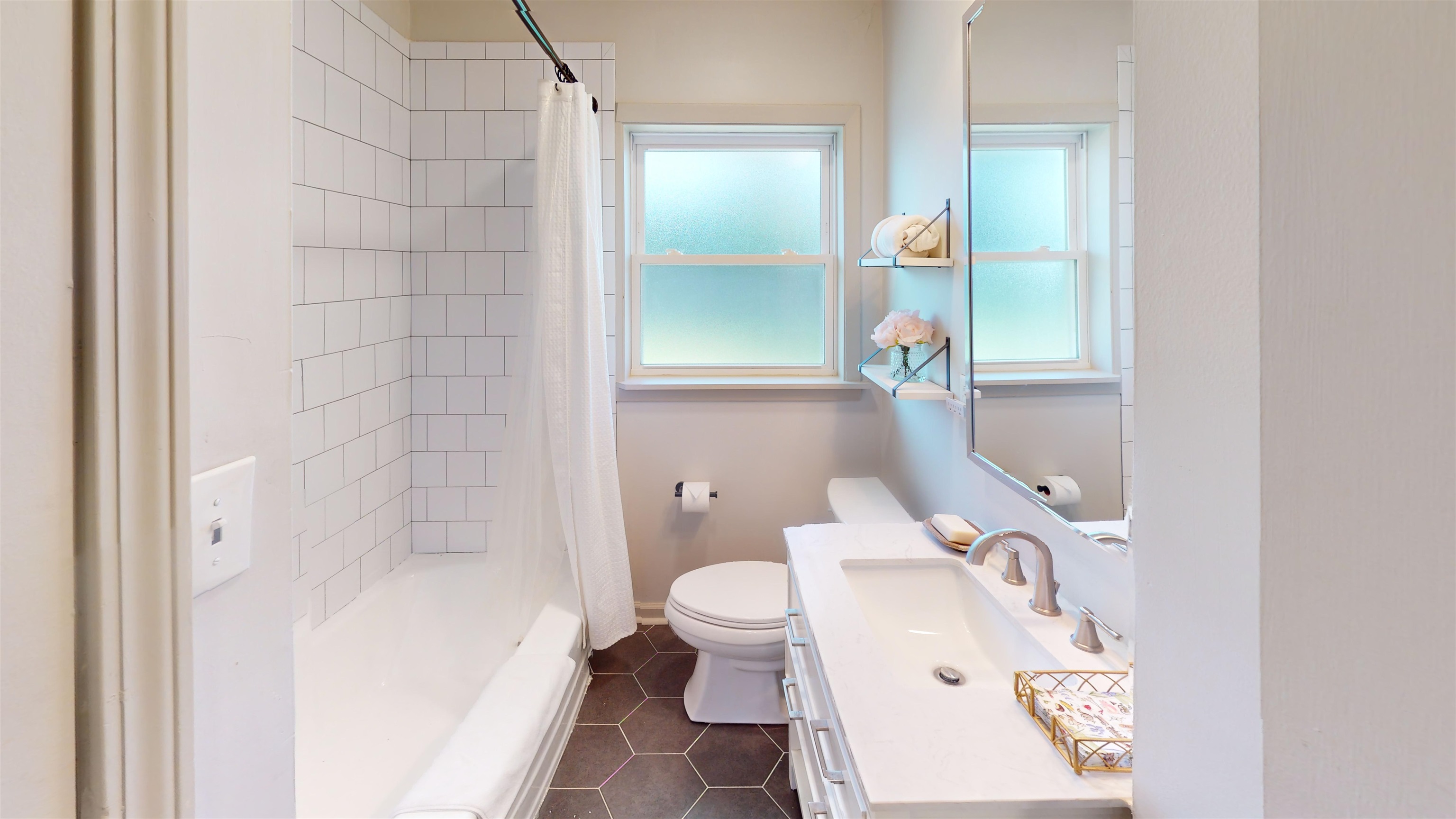 4779 Dee Road Memphis, TN 38117 - Photo 29 of 35 a bathroom with a bathtub and a toilet