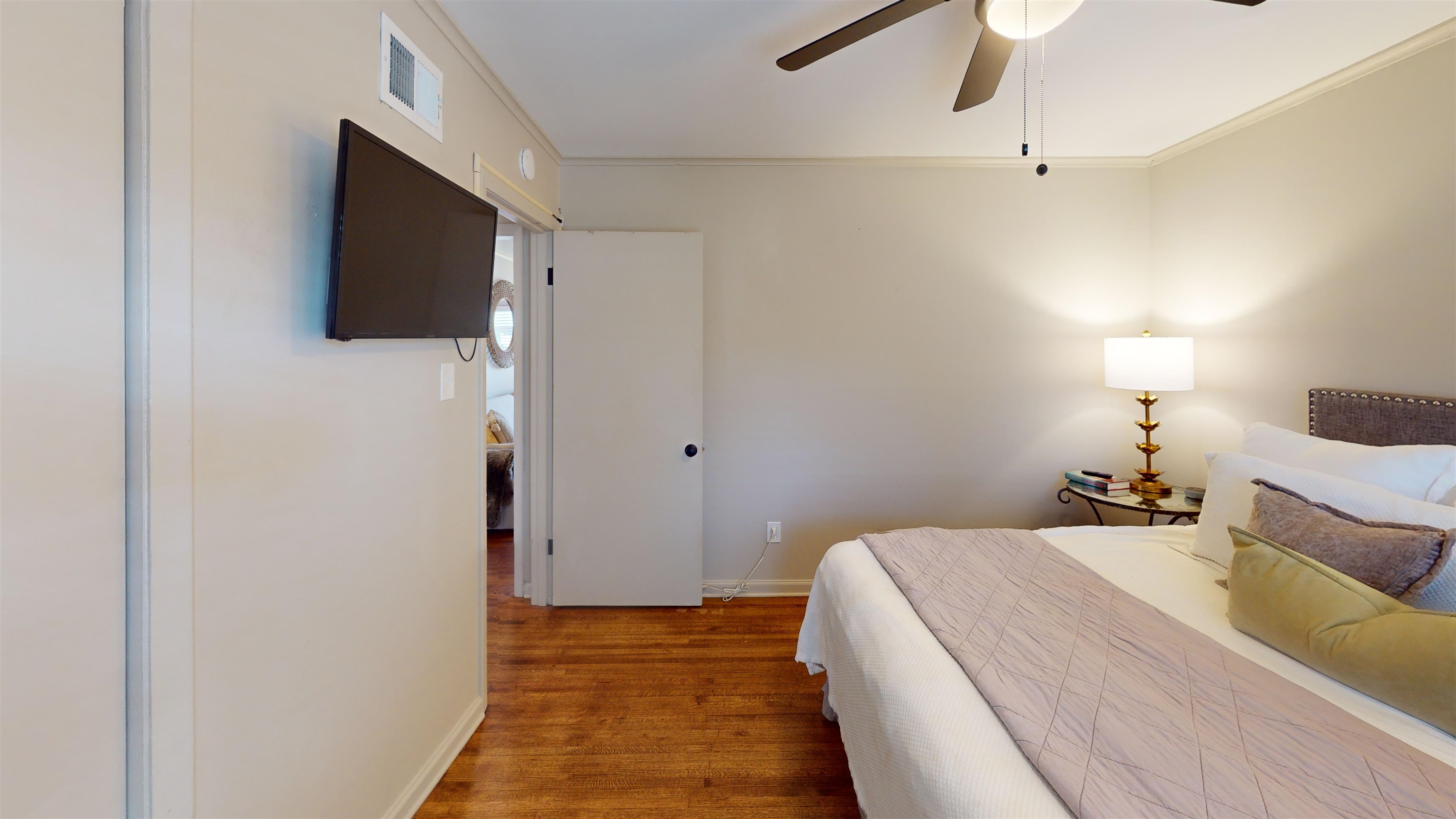 4779 Dee Road Memphis, TN 38117 - Photo 34 of 35 a bedroom with a bed and a flat screen tv