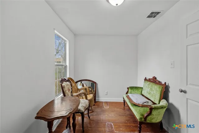 a view of a workspace with furniture and lounge chair