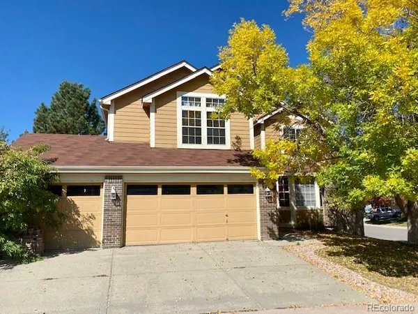 a front view of a house with a garage