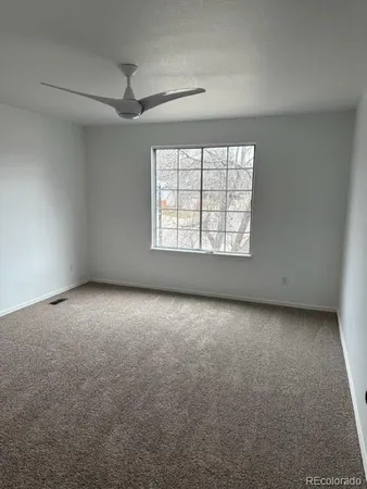 an empty room with a empty space and windows