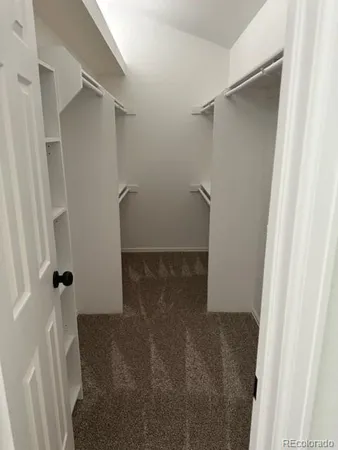 a bathroom with a glass door shower