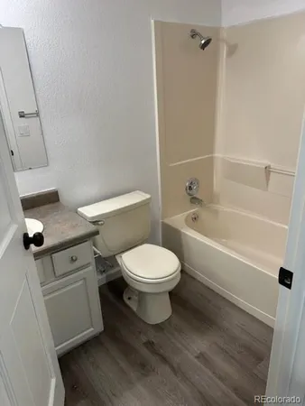a bathroom with a toilet a sink and bathtub