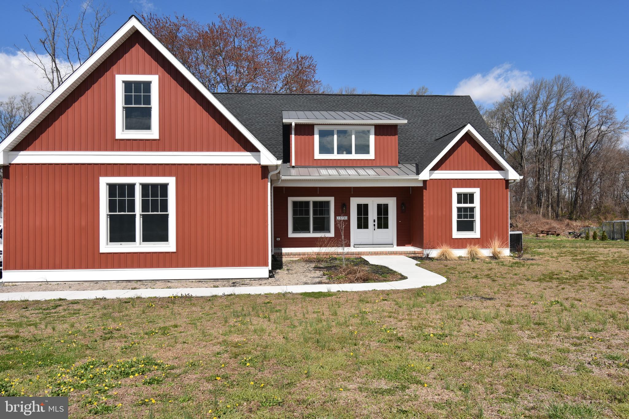 23730 Henry Road Ridgely, MD 21660 - Photo 2 of 28 a front view of a house with garden