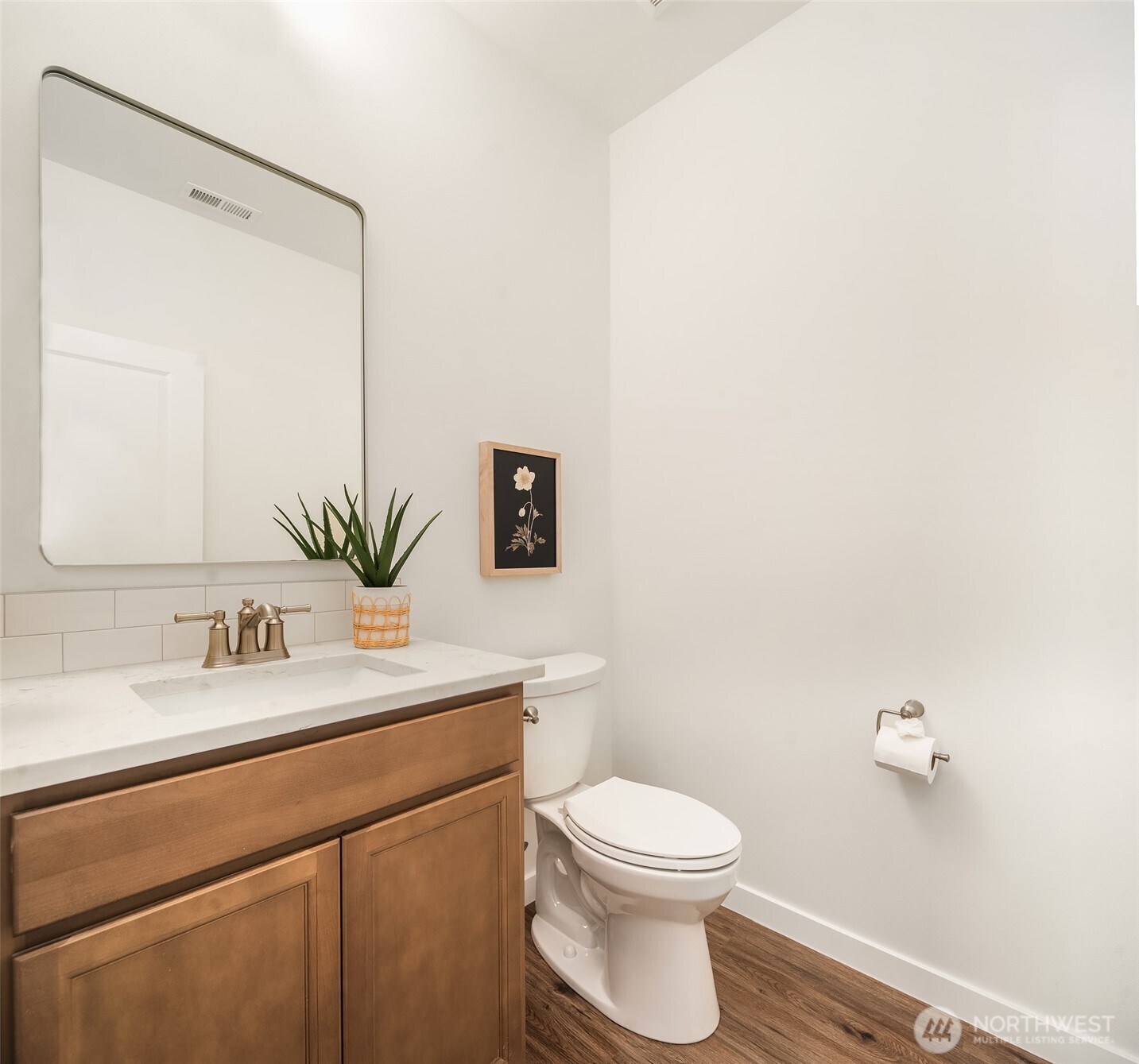 2401 East 16th Street Bremerton, WA 98310 - Photo 11 of 30 a bathroom with a toilet a sink and mirror
