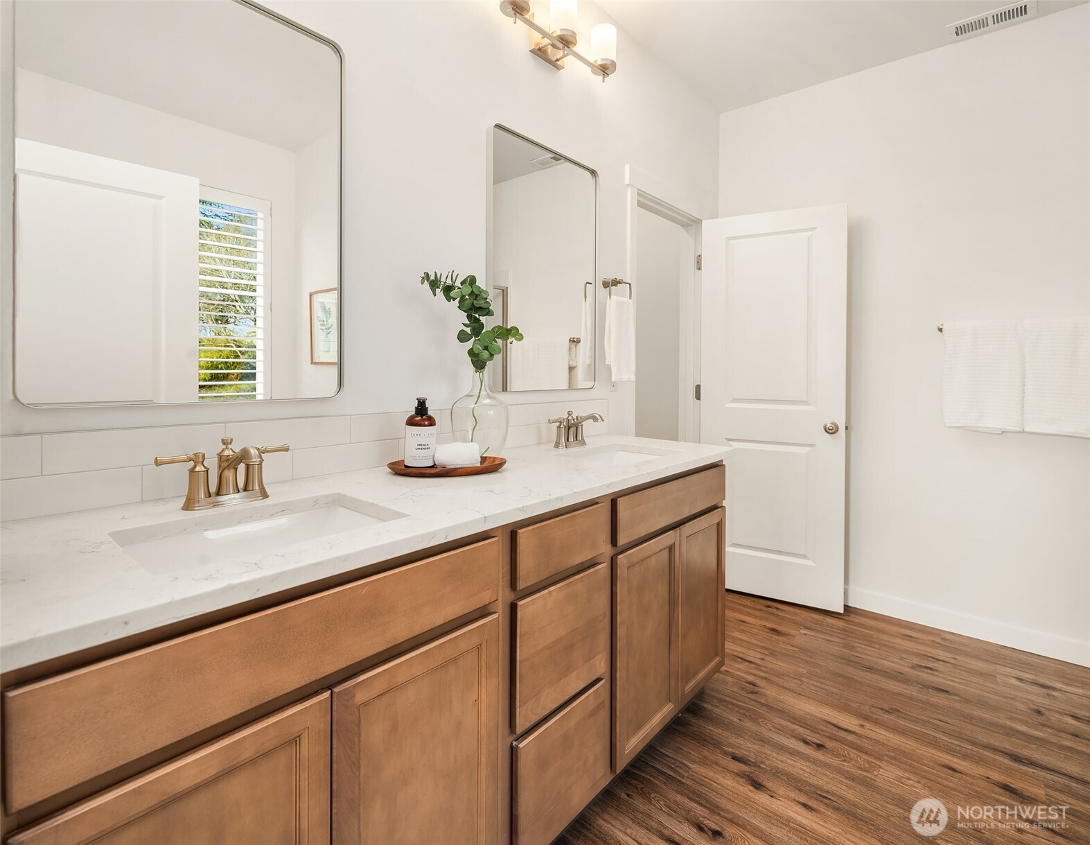 2401 East 16th Street Bremerton, WA 98310 - Photo 13 of 30 a bathroom with a double vanity sink and a mirror