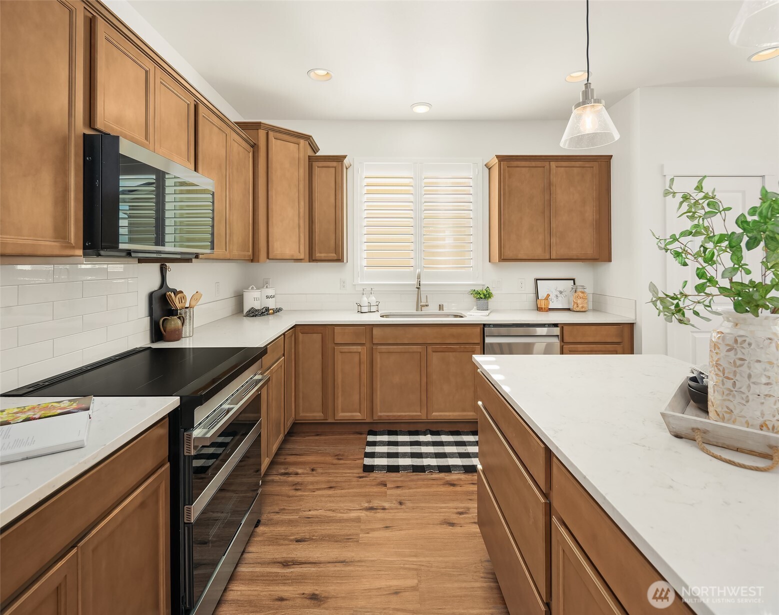 2401 East 16th Street Bremerton, WA 98310 - Photo 5 of 30 a kitchen with a sink stove top oven and microwave
