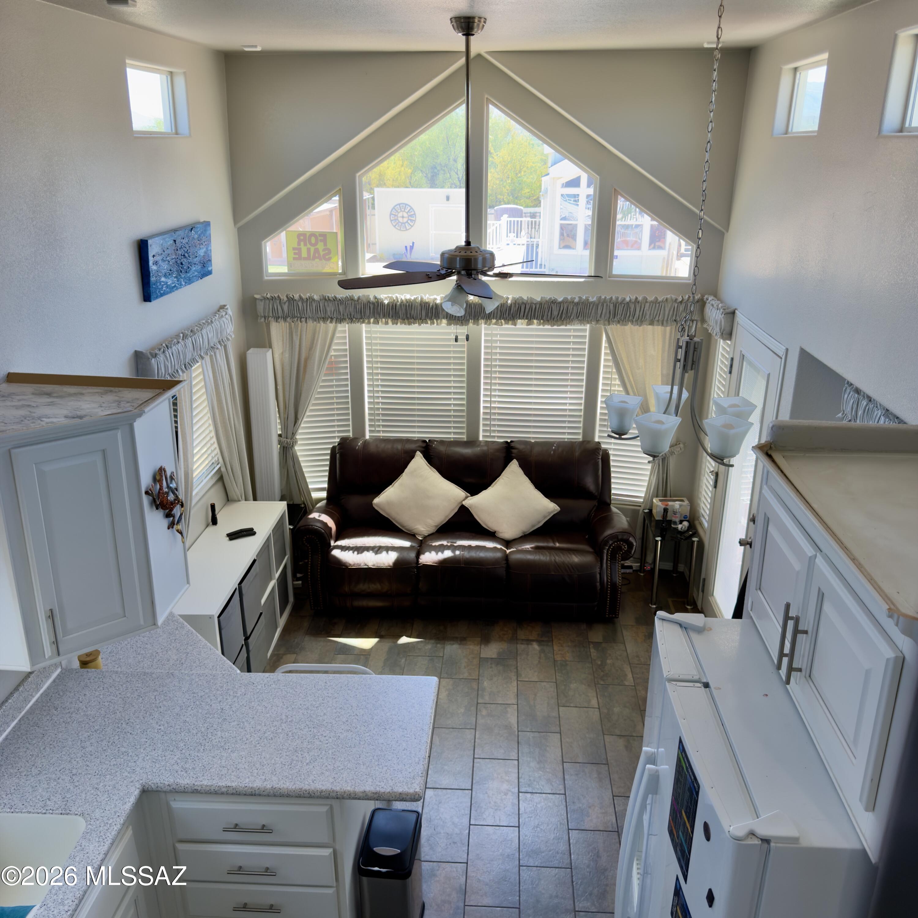 2843 19 Interstate 19 Frontage Road, Unit 116 Amado, AZ 85645 - Photo 24 of 32 a living room with furniture and a window