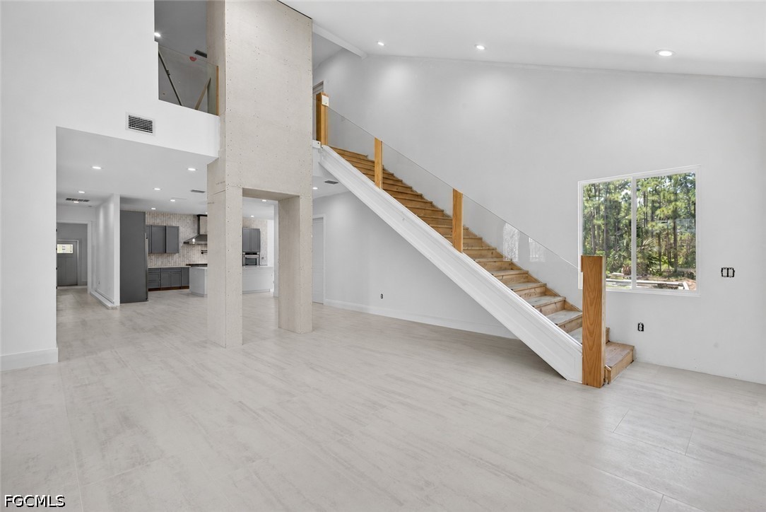 2665 Oil Well Road Naples, FL 34120 - Photo 12 of 40 a view of entryway and hall with a living room