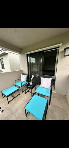 a living room with pool table and a flat screen tv