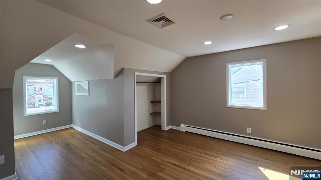 2-72 Saddle River Road Fair Lawn, NJ 07410 - Photo 16 of 33 a view of an empty room with window and wooden floor