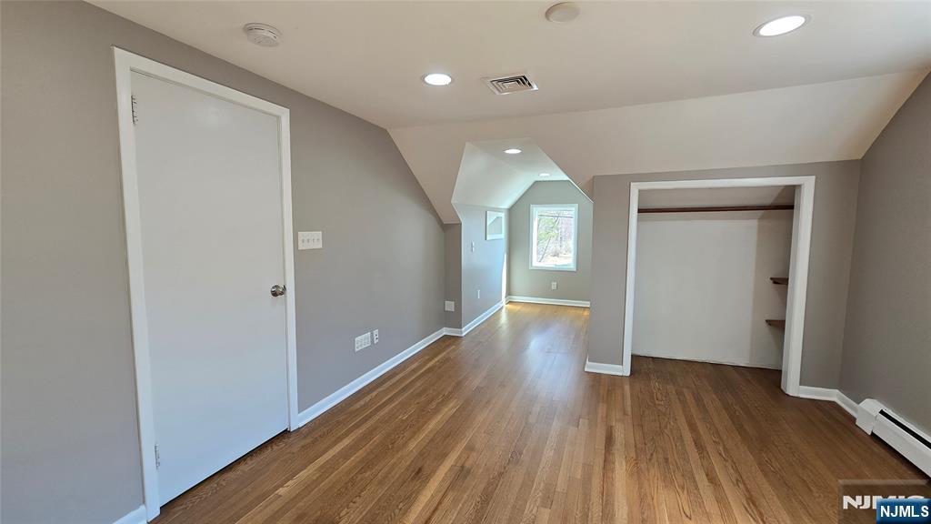 2-72 Saddle River Road Fair Lawn, NJ 07410 - Photo 17 of 33 an empty room with wooden floor and windows