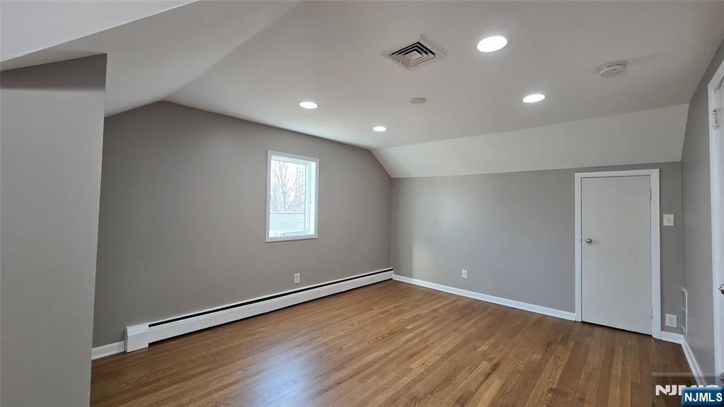 2-72 Saddle River Road Fair Lawn, NJ 07410 - Photo 18 of 33 an empty room with wooden floor and windows
