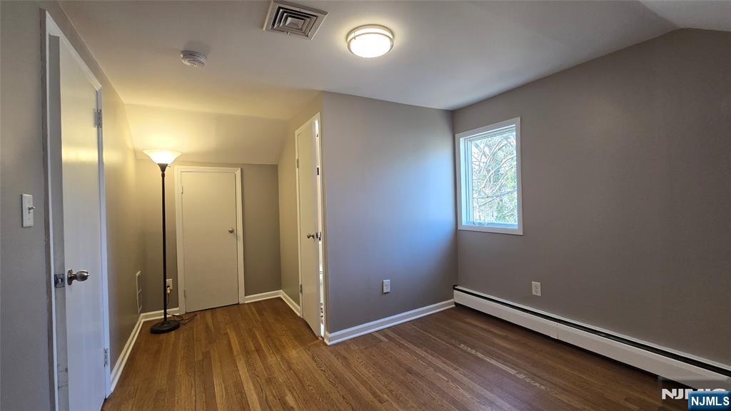 2-72 Saddle River Road Fair Lawn, NJ 07410 - Photo 19 of 33 an empty room with closet and wooden floor
