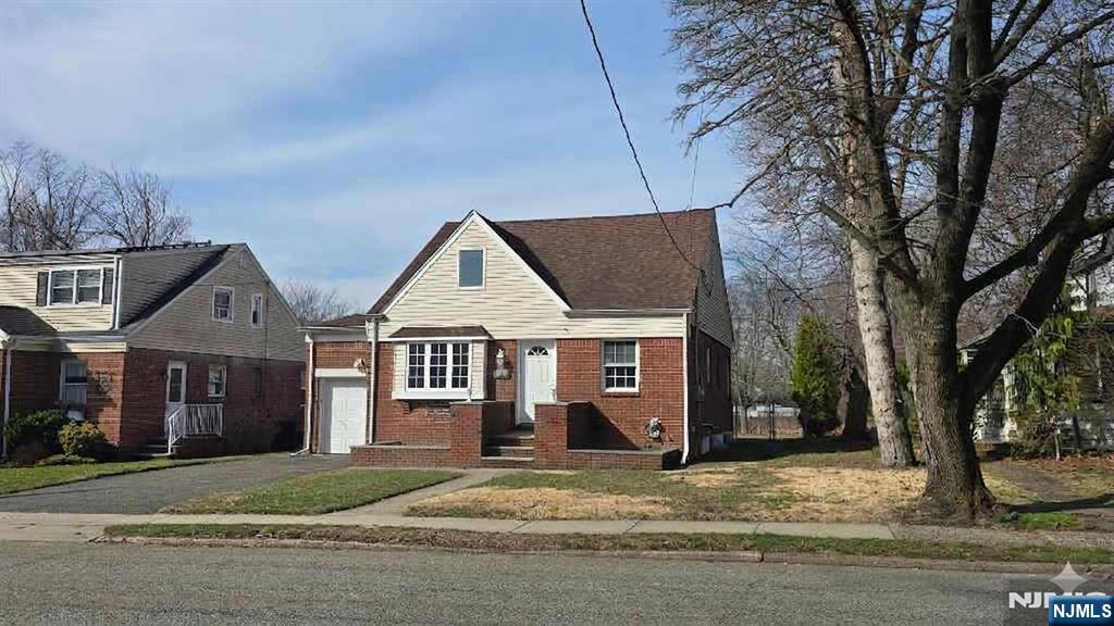 2-72 Saddle River Road Fair Lawn, NJ 07410 - Photo 33 of 33 front view of a house with a yard